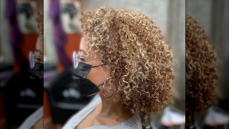 Woman models crème brûlée blond hair