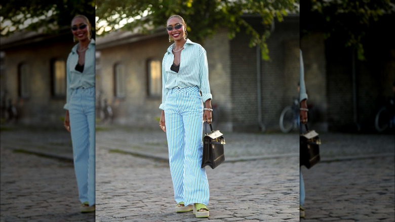 Woman wearing a striped Croisettecore outfit