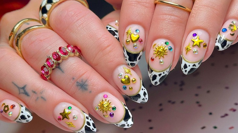 woman with colorful rhinestone nails