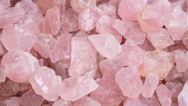 Pile of raw rose quartz crystals