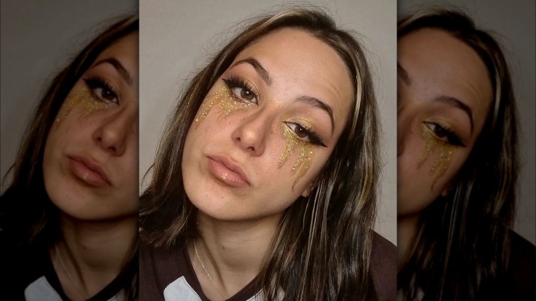 A woman with glitter tears
