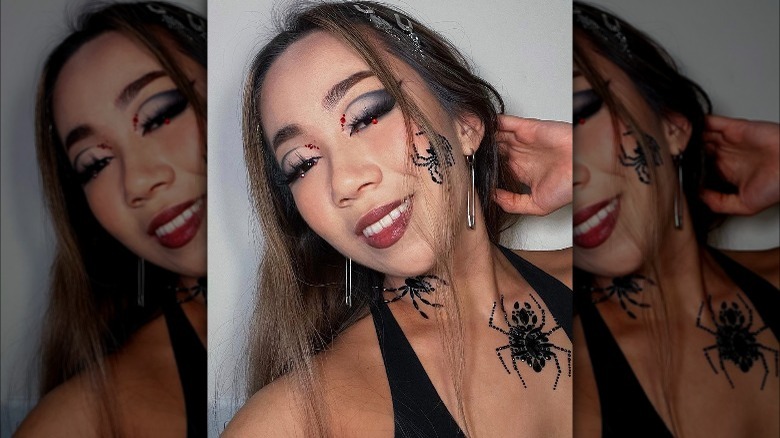 A woman with vampy spider makeup