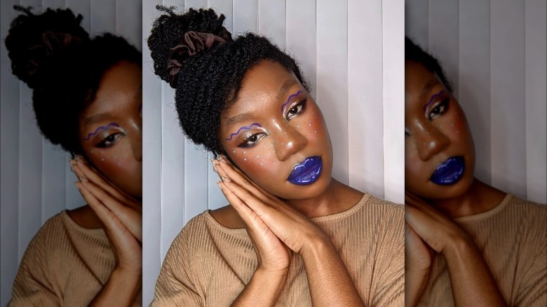 A woman with blue lipstick