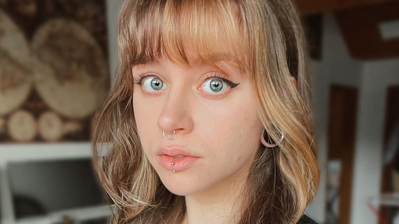 Curve Bangs' Are The Dramatic Hair Trend That Takes Curtain Fringe