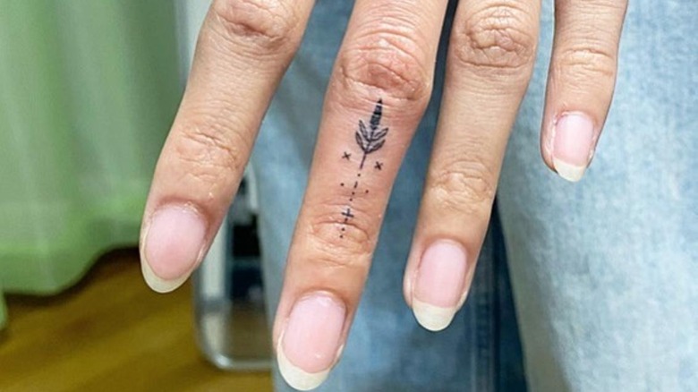 tattoo on middle finger