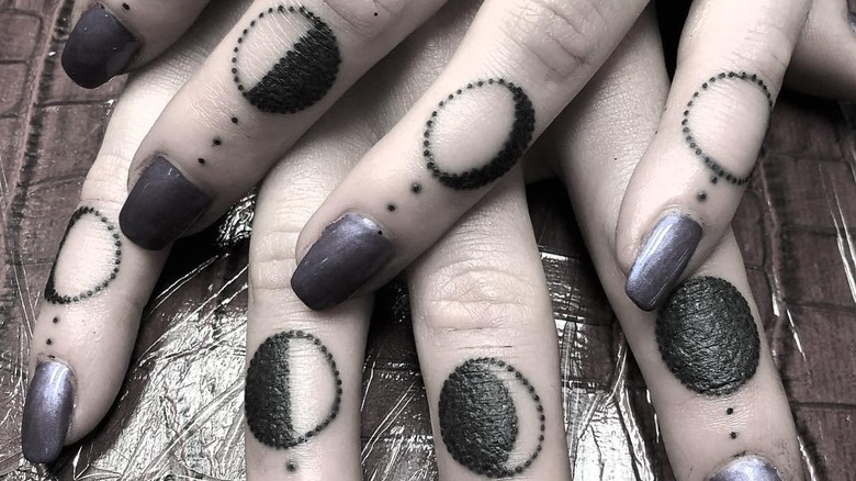 moon phase finger tattoos