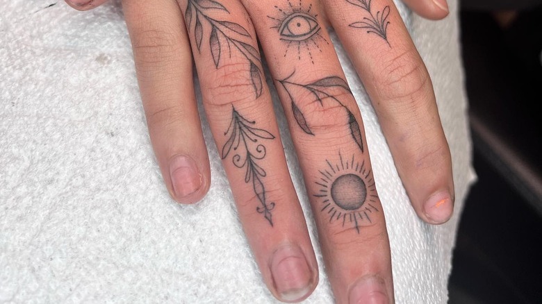 plant design finger tattoos