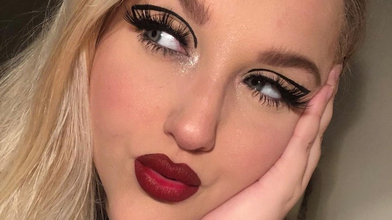 Girl with graphic liner and dark red lip