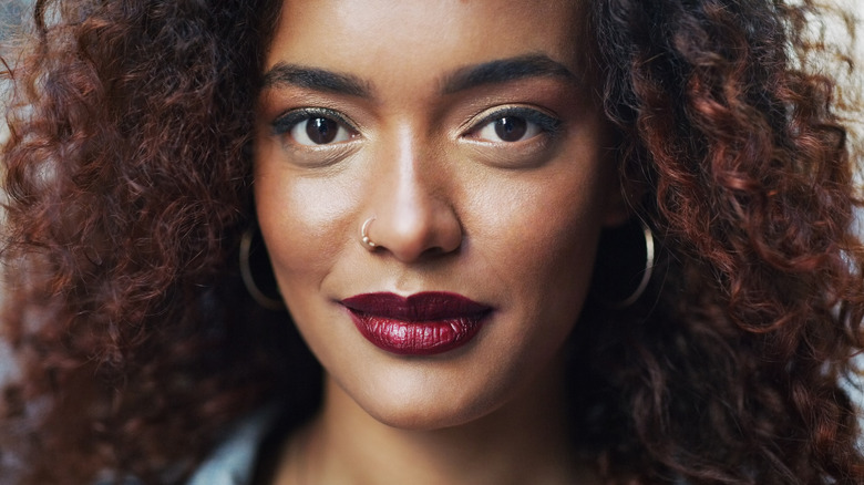 Woman wearing dark red lipstick