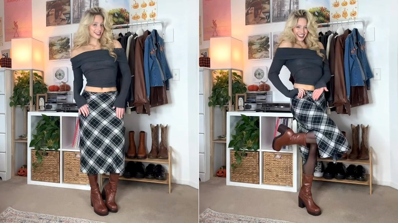 Woman wearing plaid skirt, sweater, boots