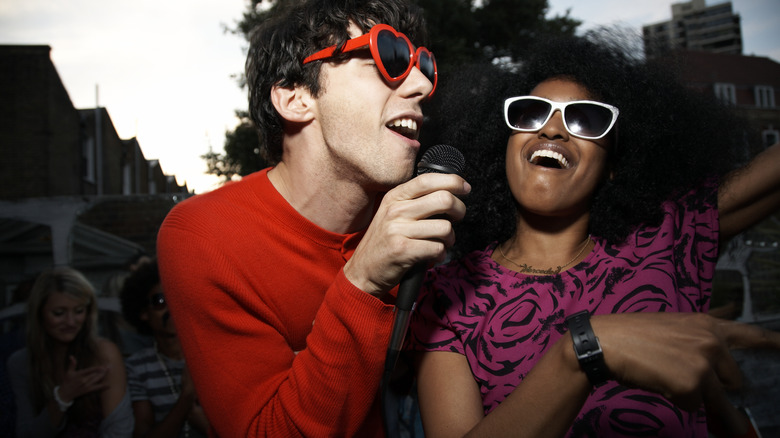 couple at karaoke party