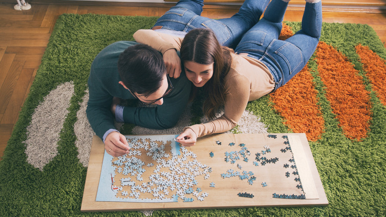 couple working on puzzle together