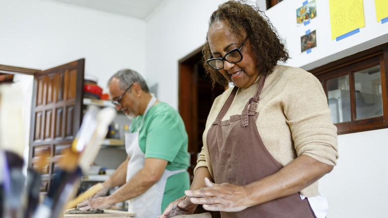 people in pottery class