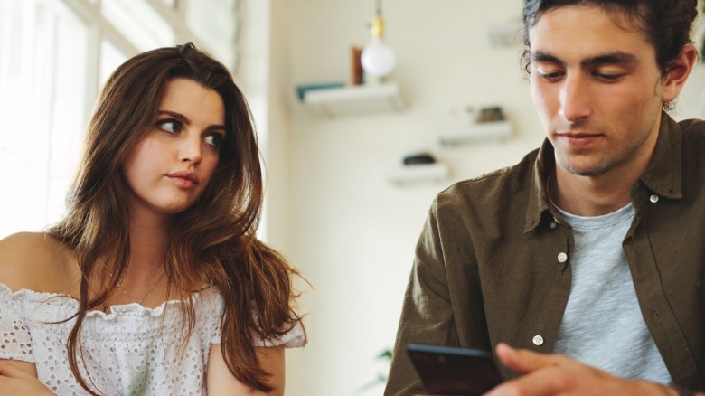 Woman staring at guy 