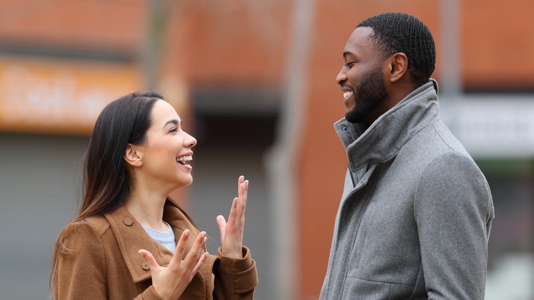 Man and women smiling at eachother