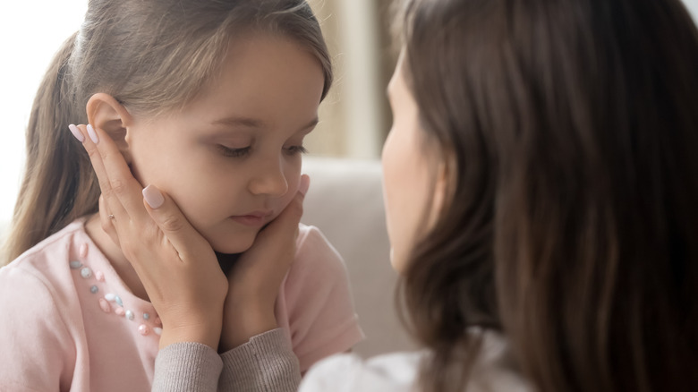 nanny comforting kid