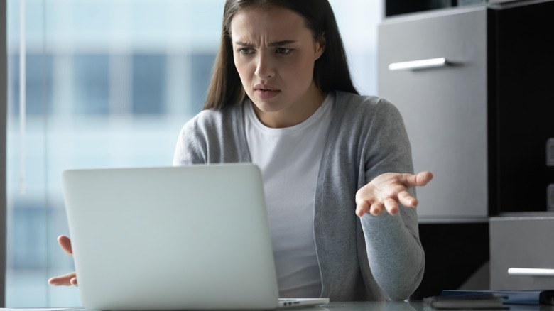 Woman getting angry at computer