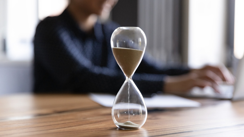 Sand timer on table