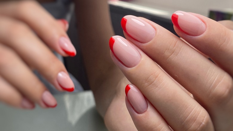 Nails with minimalist red polish