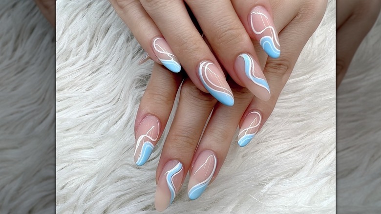 Nails with blue swirled polish