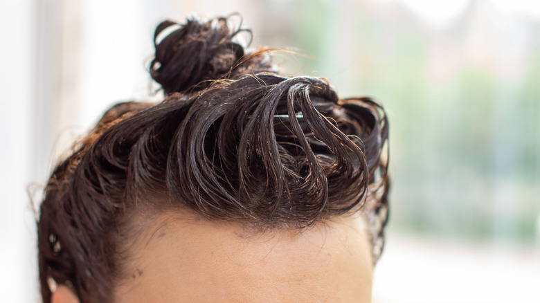 woman coloring hair