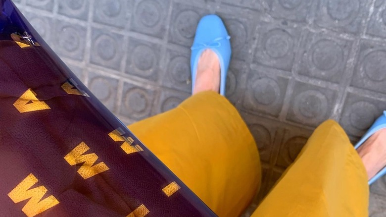 Blue ballet flats and yellow pants