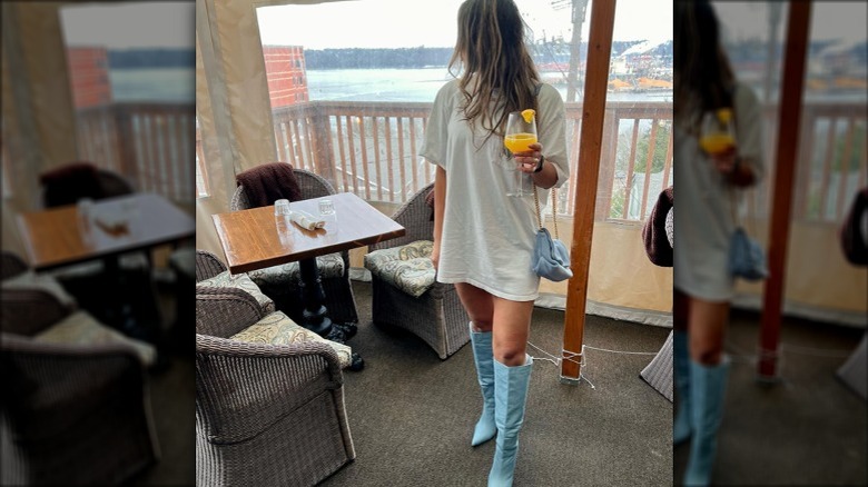 Woman in knee-high denim boots