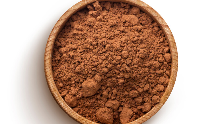 Cocoa powder in wooden bowl