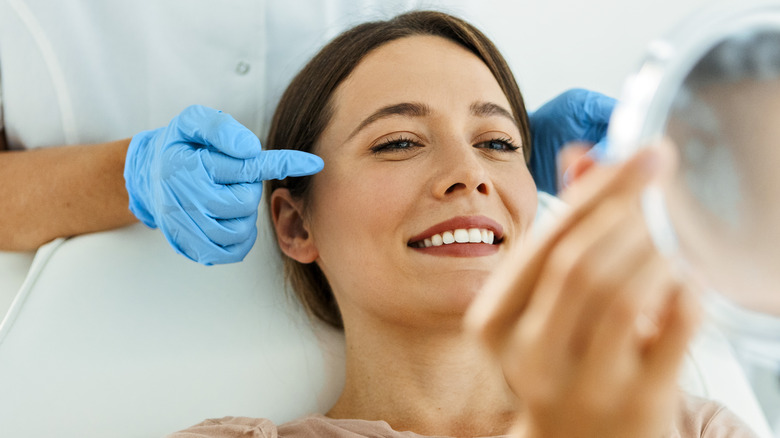 Woman at dermatologist getting eye treatments