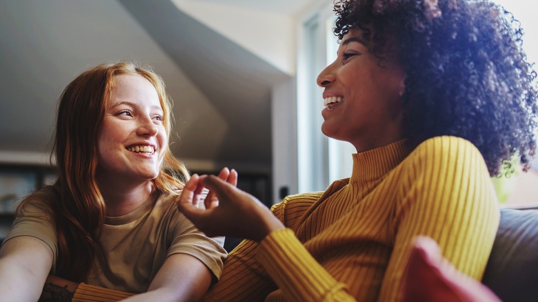 Couple sitting together laughing