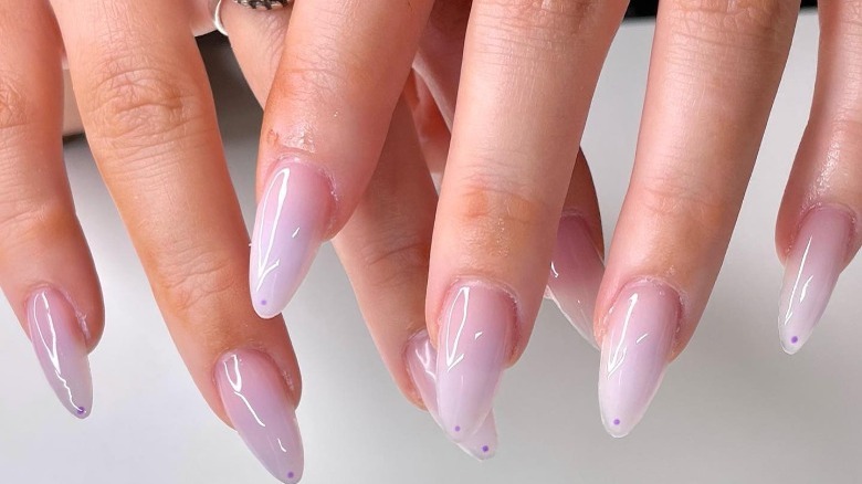 hands with digital lavender color manicure 