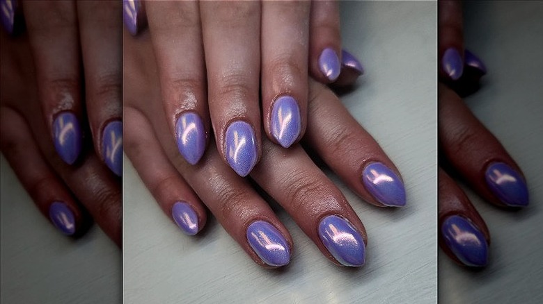 hand with digital lavender nails 