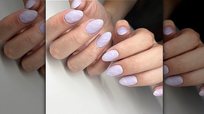 hand with marble nails in lavender