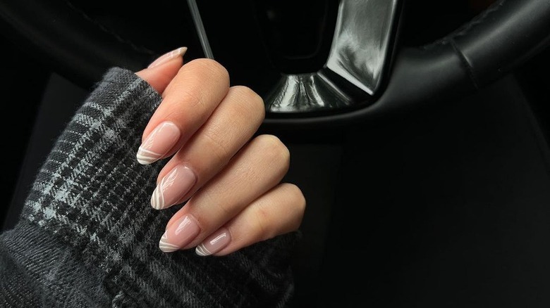 woman with line design dip manicure