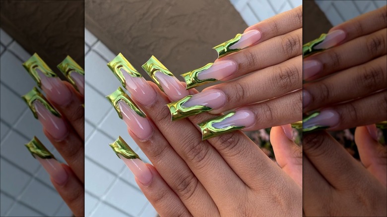 woman wearing gilded nails