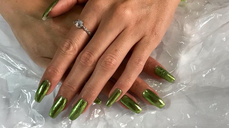 woman wearing textured chrome nails