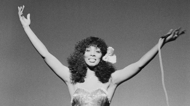 Donna Summer raising her arms