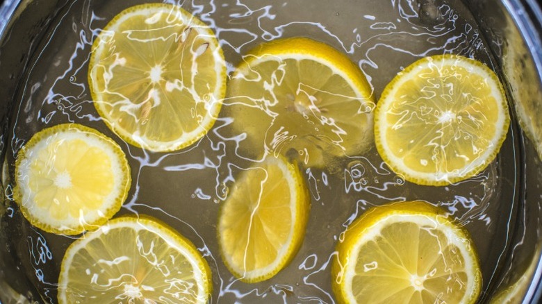 Lemon slices boiling in pot of water