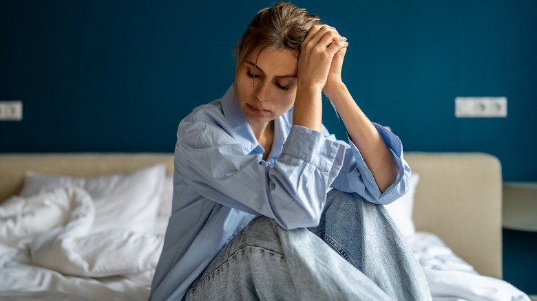 stressed woman struggling to sleep