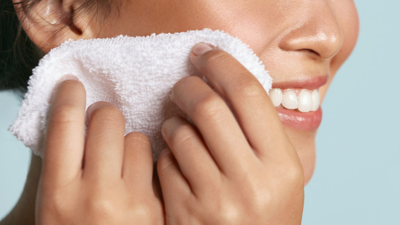 clean face with a wash cloth