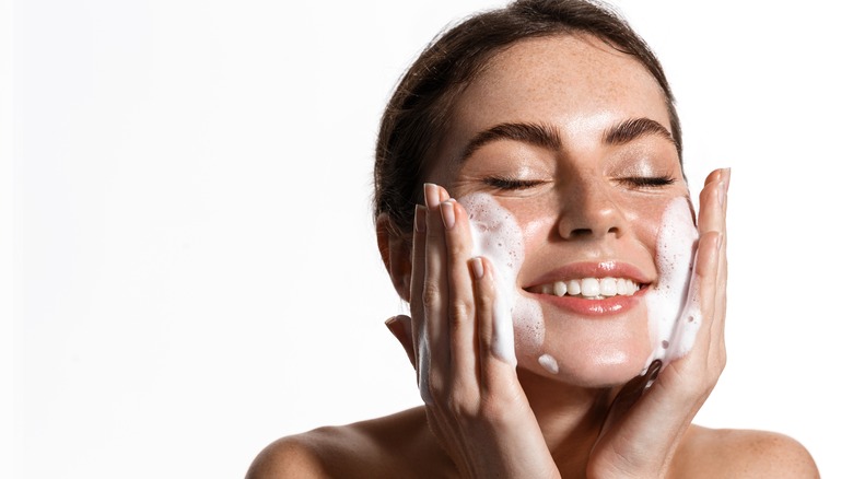 woman applying skincare product