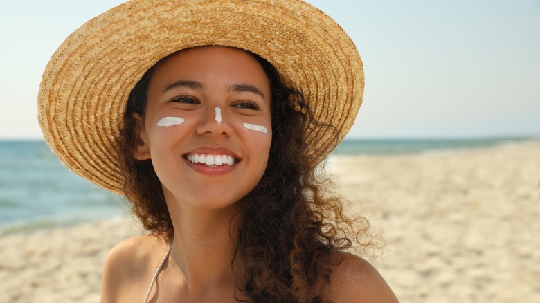Woman with hat and sunscreen