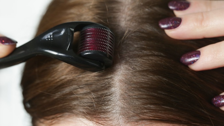 close up of derma rolling for hair 