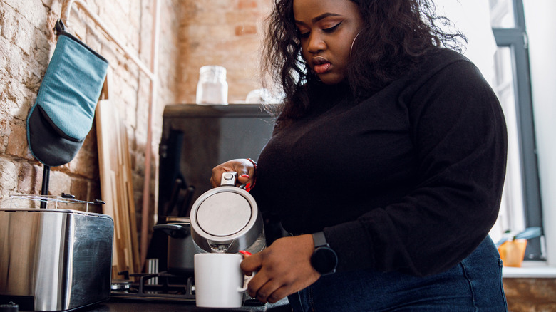 woman making homemade tea