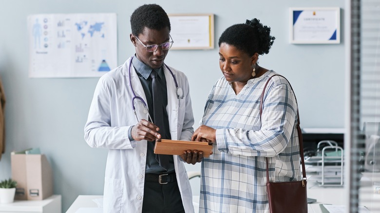 woman discussing health with doctor