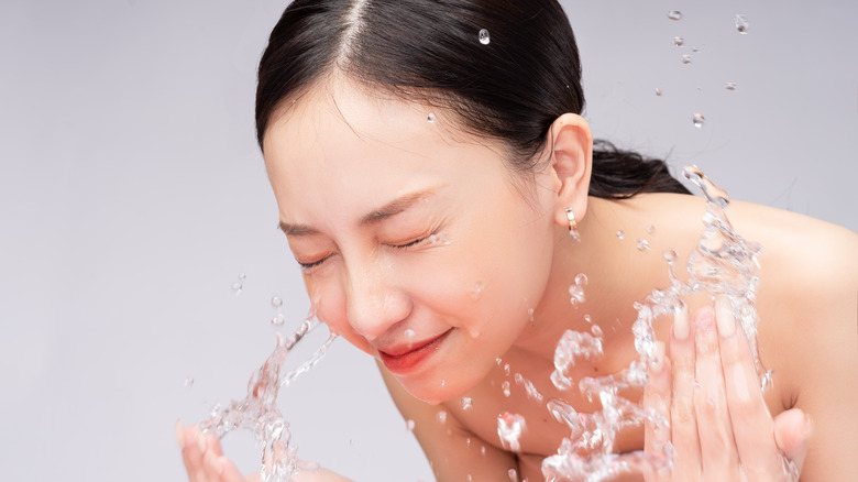 lady washing her face