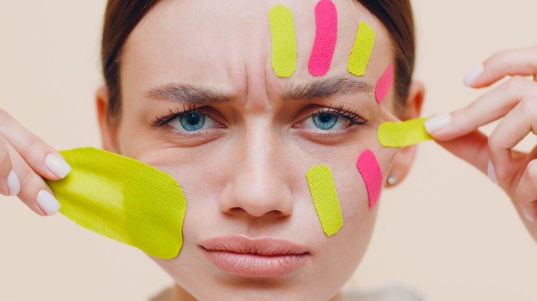 disappointed woman face-taping