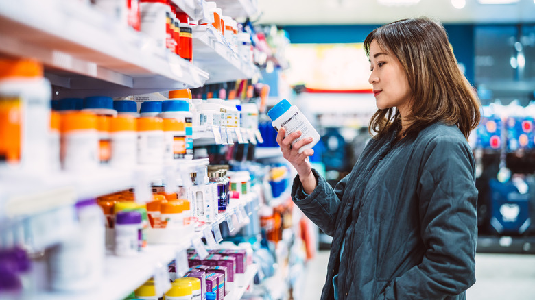 A woman buying supplements