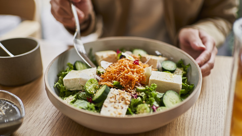 A woman eating a salad