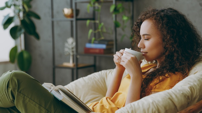 Woman drinking from a mug 